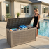 120 gallon light brown outdoor storage deck box beside pool for towels and outdoor accessories