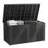Extra large 260 gallon black resin deck box with open lid storing outdoor pillows, toolboxes, garden hoses and accessories.