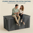 Black 260 gallon outdoor storage bench with reinforced steel supports and two adults seated on the lid.
