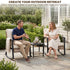 Two people relaxing in patio rocking chairs with a side table