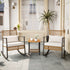 Two woven rattan rocking chairs with side table in a bright sunroom