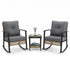 Two patio rocking chairs with matching side table and dark cushions