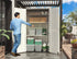 vertical outdoor storage cabinet with garden tools stored inside