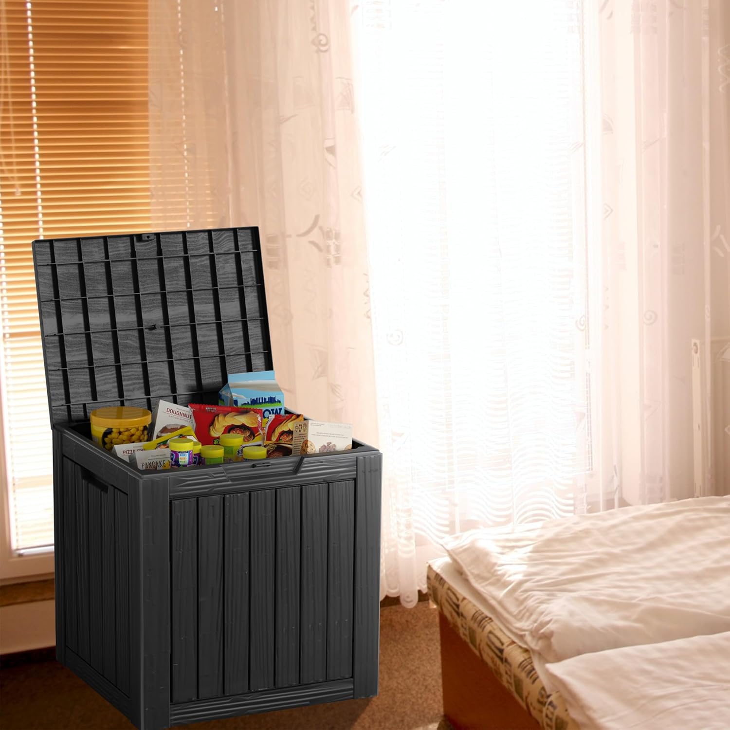 30 gallon deck box with open lid storing everyday household and patio items