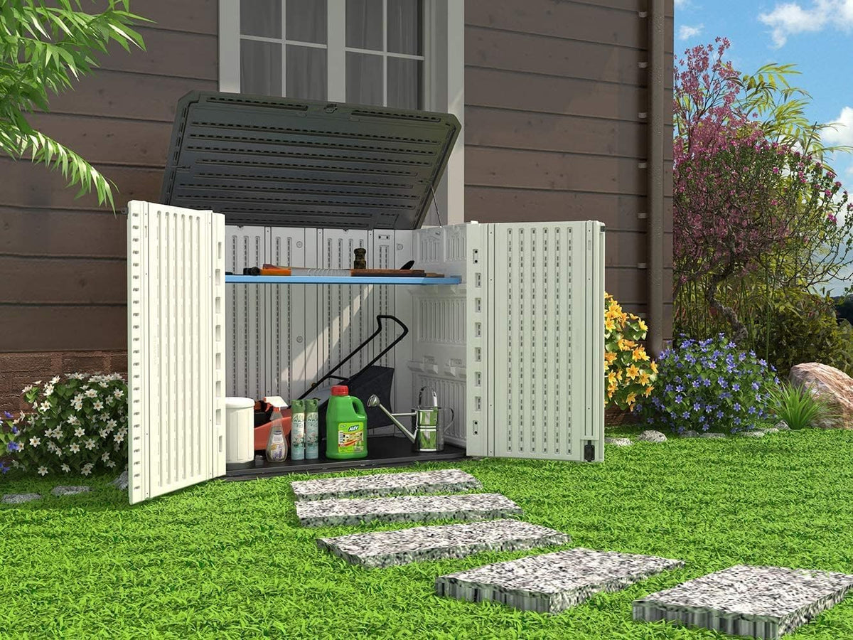 bike storage shed beside lawn and backyard garden area