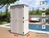 white vertical outdoor storage shed beside patio and garden wall