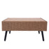 Side view of square wicker patio coffee table with black tapered metal legs