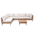 L-shaped outdoor sectional sofa with beige seat cushions and central wicker coffee table