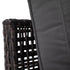 Close-up of piped grey back cushion beside woven rattan sofa frame