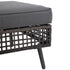 Adjustable foot detail on black tapered metal leg of wicker patio sofa