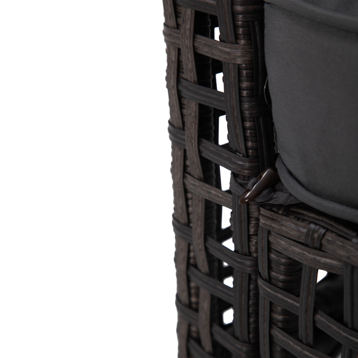 Cushion toggle fastening detail on dark grey wicker outdoor sofa