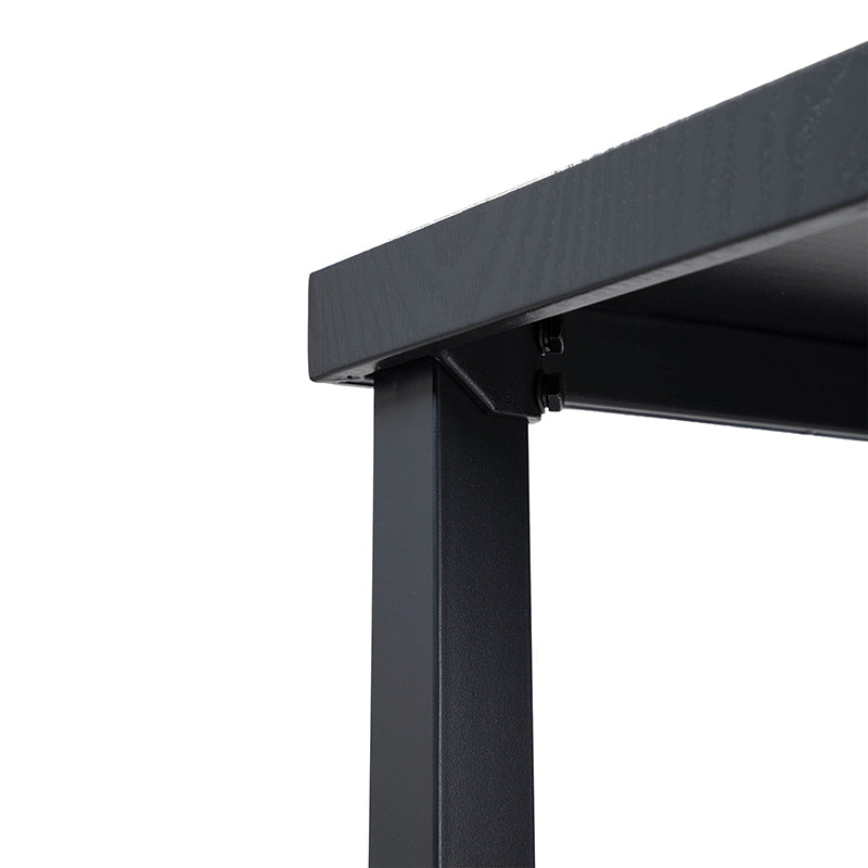 Close-up of black powder-coated metal table leg and frame joint