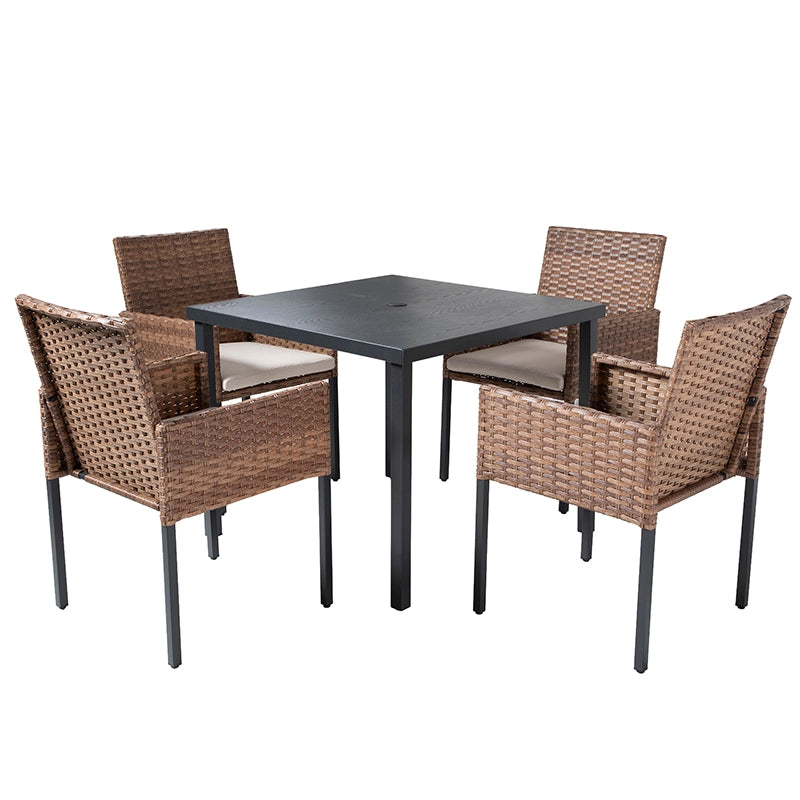 5 piece outdoor rattan dining set with four beige cushioned armchairs