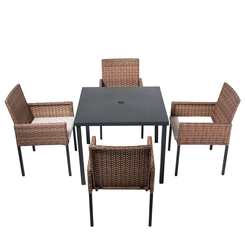 Front view of wicker patio dining table and four matching armchairs