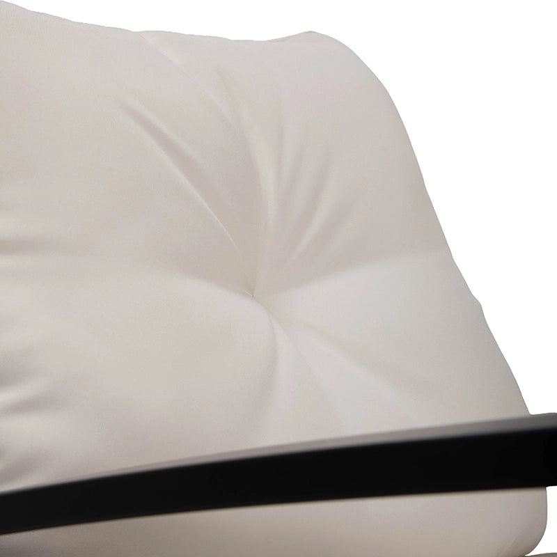 Close-up of padded rocking chair seat cushion with piped upholstery edge