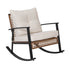 Angled front view of wicker porch rocker with padded cushions and armrests