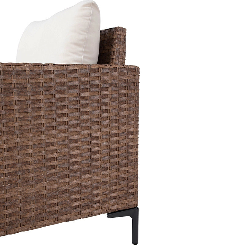 Side view of outdoor sofa module with woven wicker backrest