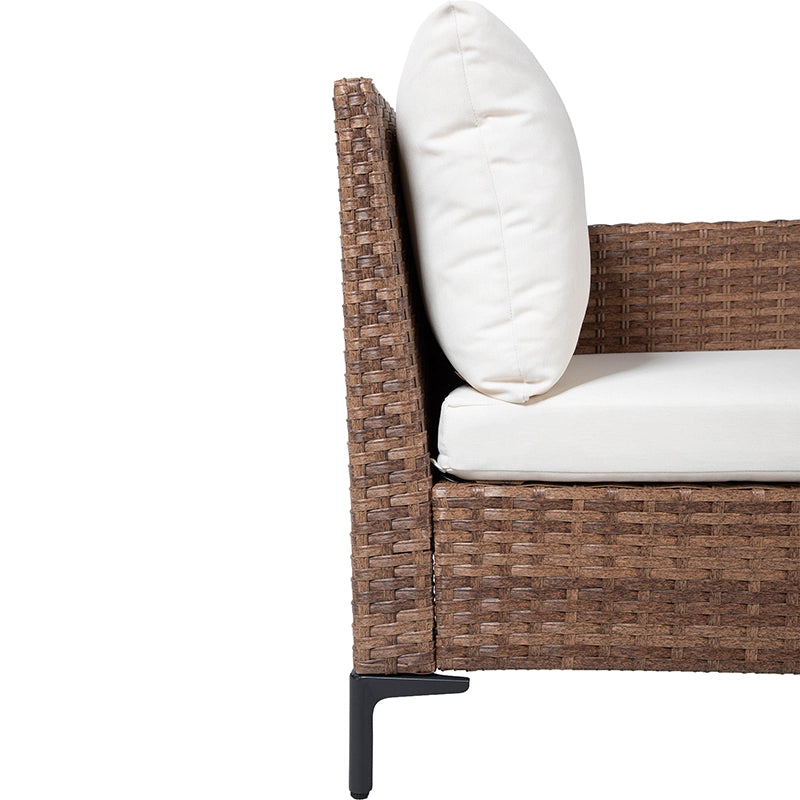 Side angle of cushioned rattan sectional sofa with raised armrest