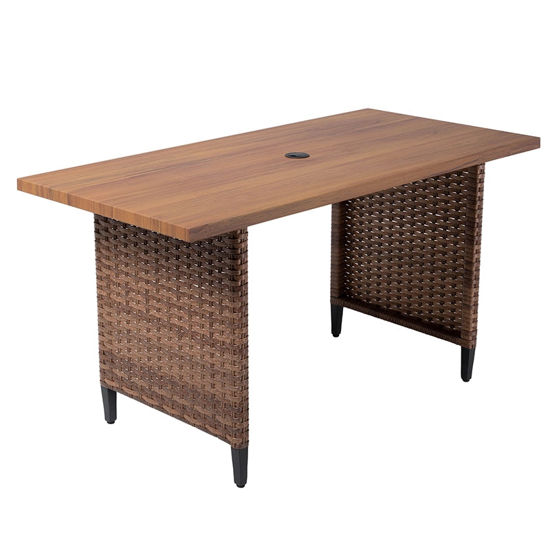 Angled view of rattan outdoor sofa dining table with woven support panels