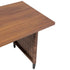Corner detail of rectangular wood-look patio tabletop and wicker support