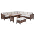 Wicker corner sofa and rectangular table arranged for backyard dining