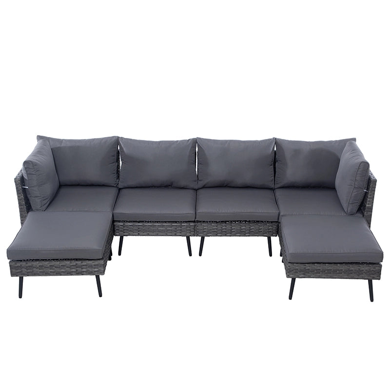 Front view of modular wicker patio sectional with matching square cushioned ottomans