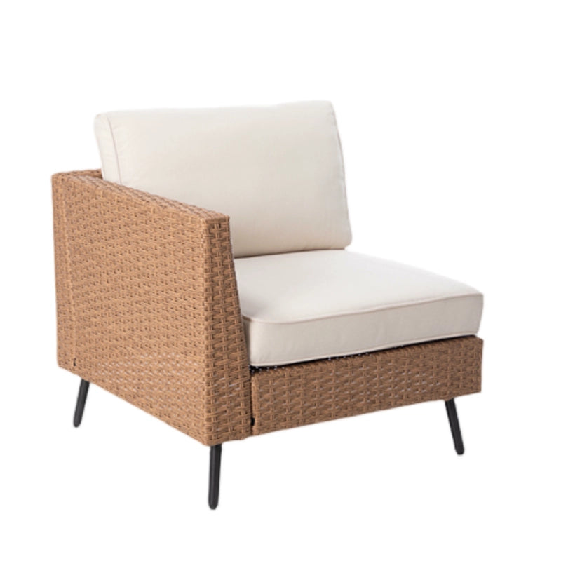 Front angled view of wicker patio sofa module with beige cushions and metal legs