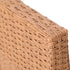 Close-up of natural brown woven wicker furniture corner and rounded edge