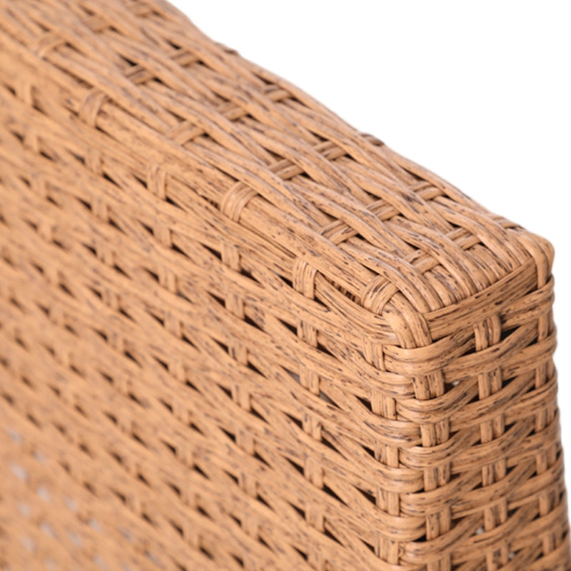 Close-up of natural brown woven wicker furniture corner and rounded edge