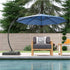 Blue 10 ft cantilever umbrella beside poolside lounge seating