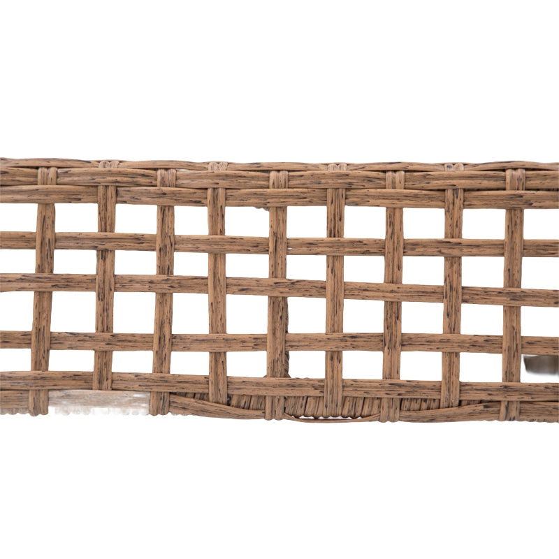 Close-up of natural brown open-grid wicker weaving on patio sectional sofa