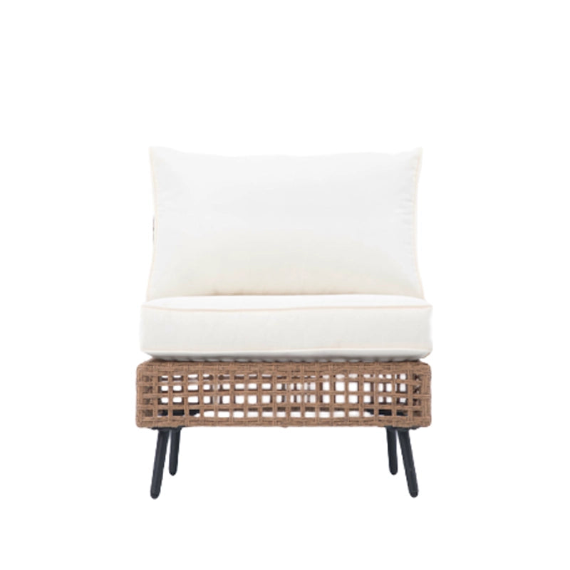 Front view of armless wicker sectional sofa module with beige cushions