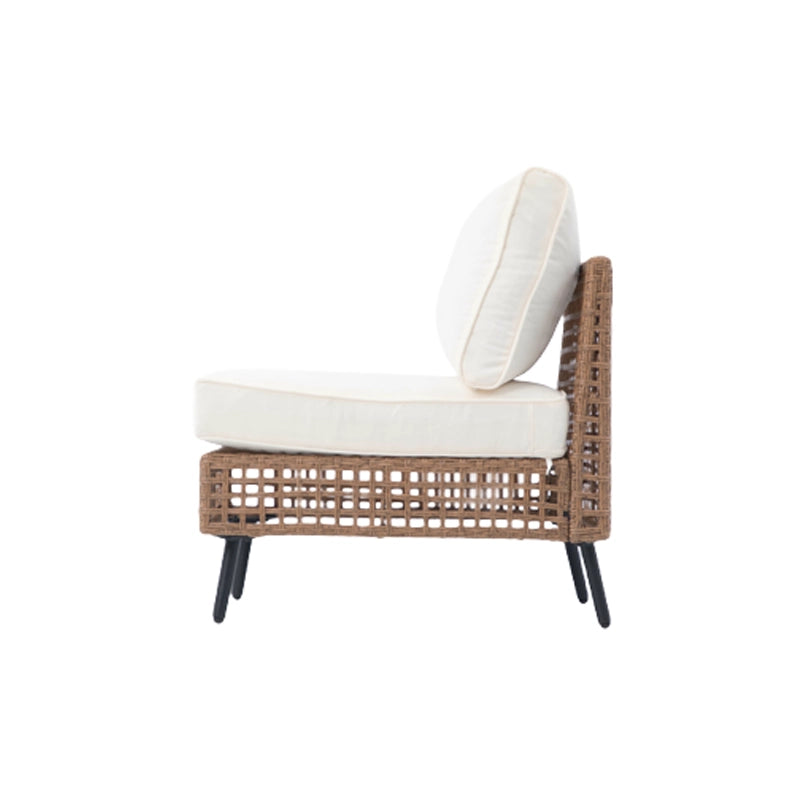 Side profile of outdoor rattan sofa seat with thick beige back cushion