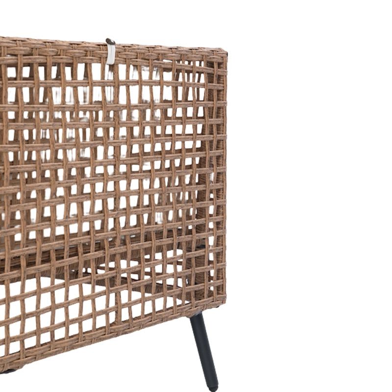 Rear view of open-weave wicker sofa backrest with square-grid pattern