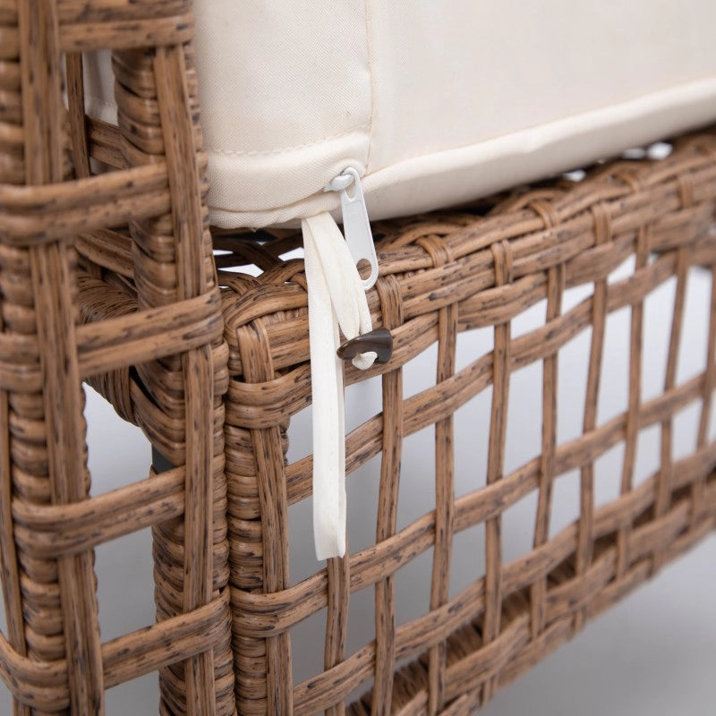 Beige sofa back cushion attachment strap on woven rattan frame