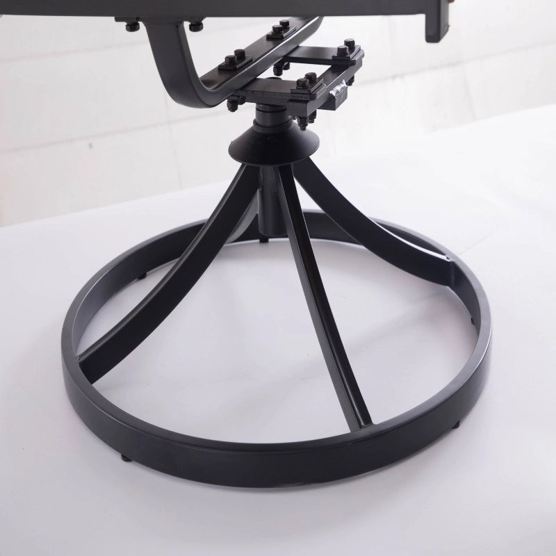 Circular metal swivel base beneath outdoor wicker dining chair