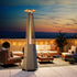 Glass tube tower patio heater for outdoor evening lounge area