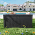 Black outdoor deck box in a backyard poolside setting
