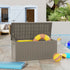 Black 230 gallon deck box storing pool accessories beside a backyard pool