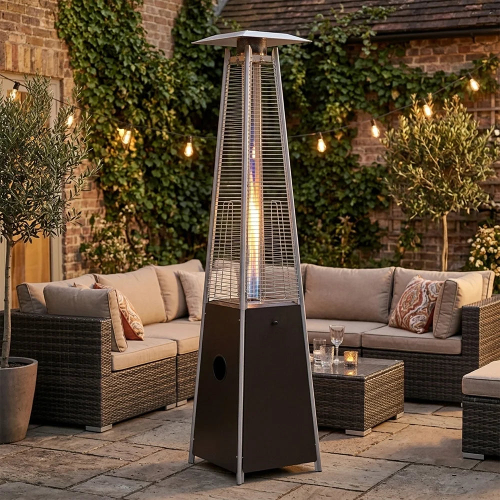 Outdoor glass tube patio heater beside lounge furniture