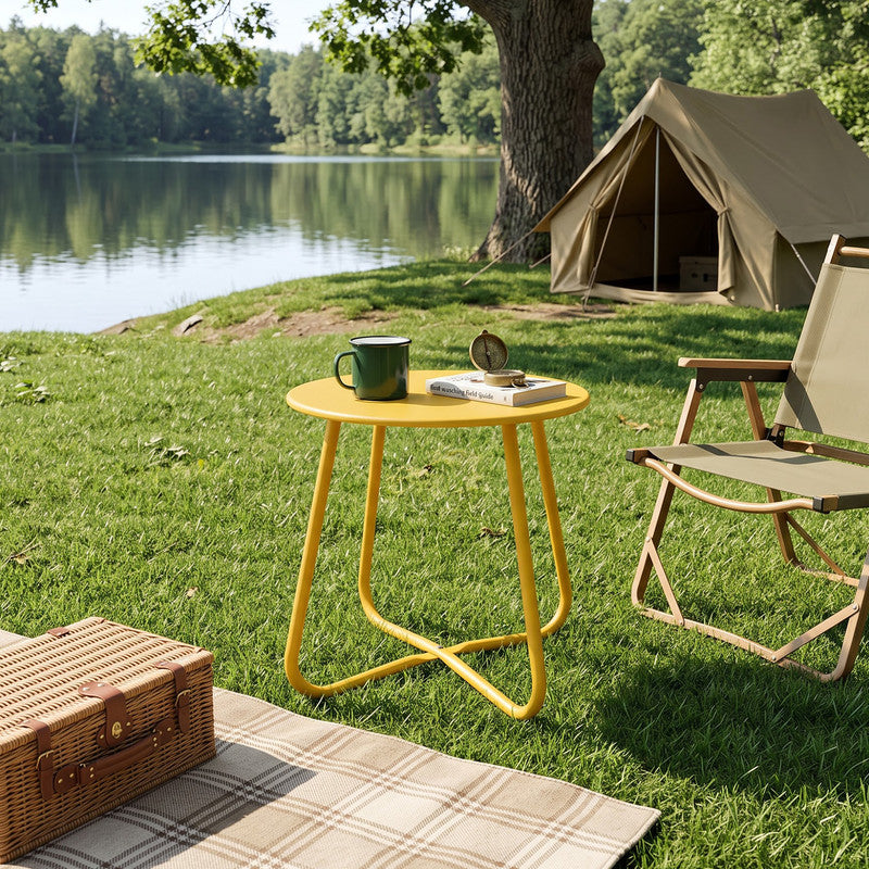 Yellow outdoor metal round side table beside garden chairs for patio drinks and outdoor décor