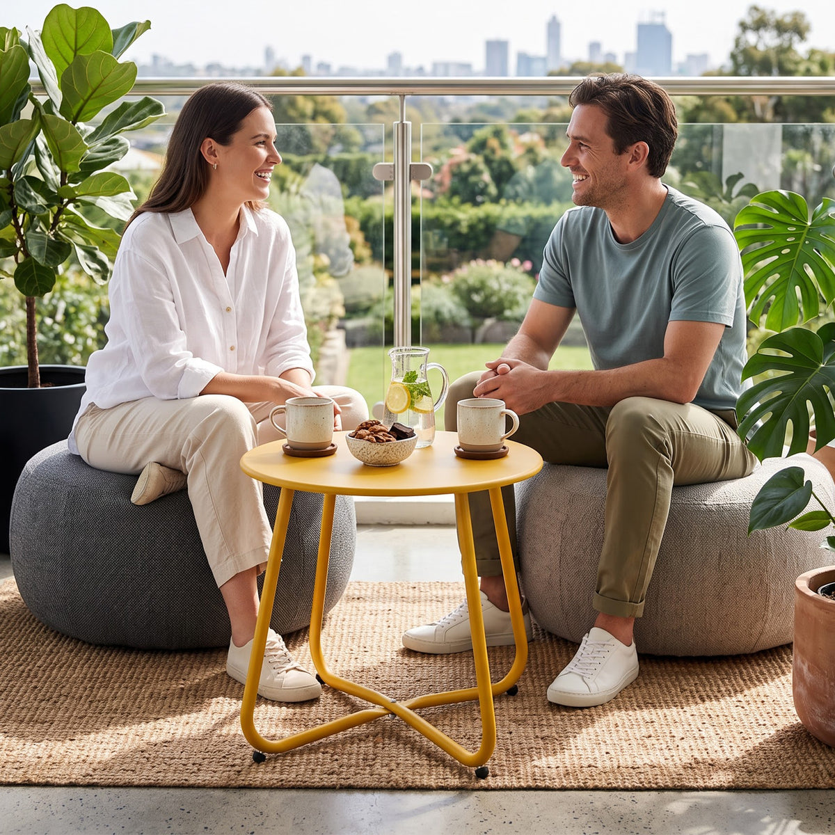 Yellow outdoor metal round side table used beside lounge chairs for drinks, plants, and decorations
