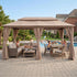 Beige outdoor gazebo with curtains for patio dining area