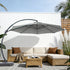 11 ft curved cantilever patio umbrella shading an outdoor lounge area